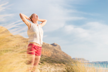 Image showing Free Happy Woman Enjoying Sun on Vacations.