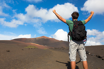 Image showing Man reaching the top of mountain.