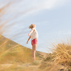 Image showing Free Happy Woman Enjoying Sun on Vacations.