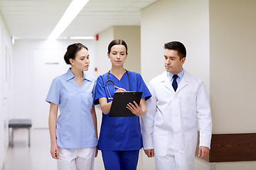 Image showing group of medics at hospital with clipboard