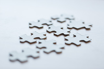 Image showing close up of puzzle pieces on table