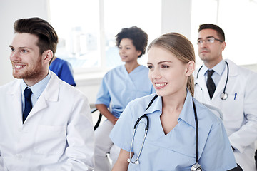 Image showing group of happy doctors on seminar at hospital