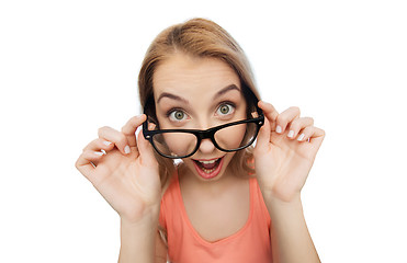 Image showing happy young woman or teenage girl in eyeglasses
