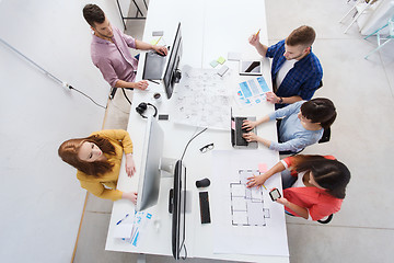 Image showing creative team with computers, blueprint at office