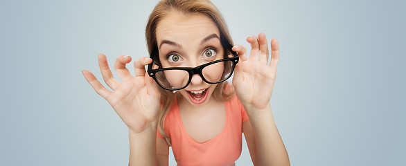 Image showing happy young woman or teenage girl in eyeglasses