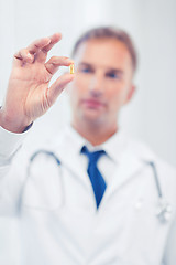 Image showing doctor with pill in hospital