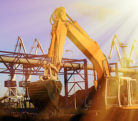 Image showing Hydraulic excavator at work. Shovel bucket against blue sky