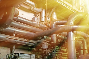 Image showing Equipment, cables and piping as found inside of a modern industr