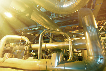 Image showing Equipment, cables and piping as found inside of a modern industr