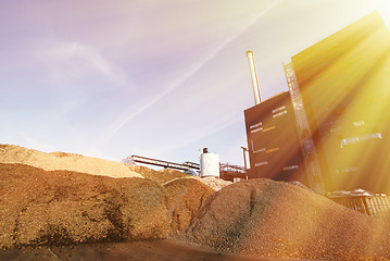 Image showing bio power plant with storage of wooden fuel (biomass) against bl