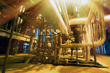 Image showing Equipment, cables and piping as found inside of a modern industr