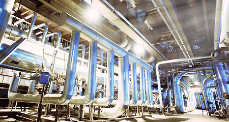 Image showing Equipment, cables and piping as found inside of a modern industr