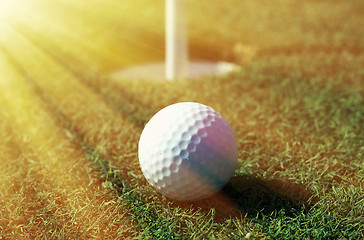 Image showing Golfball in front of the hole