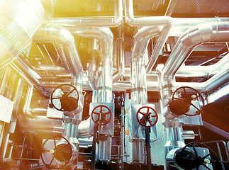 Image showing Equipment, cables and piping as found inside of a modern industr