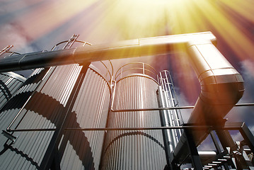 Image showing Industrial zone, Steel pipelines and valves against blue sky