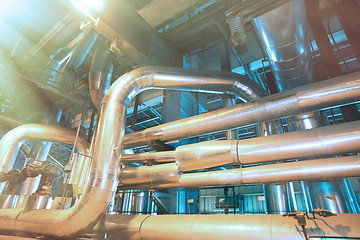 Image showing Equipment, cables and piping as found inside of a modern industr