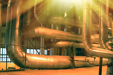 Image showing Equipment, cables and piping as found inside of a modern industr