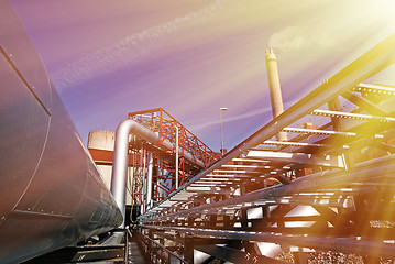 Image showing Industrial zone, Steel pipelines and valves against blue sky