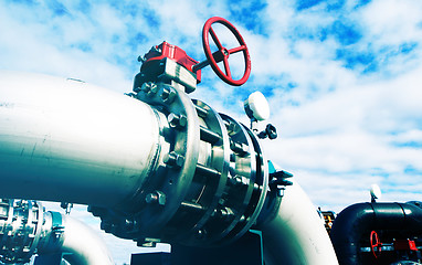 Image showing Industrial zone, Steel pipelines and valves against blue sky