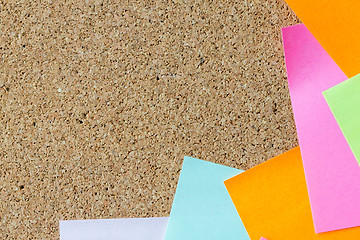 Image showing close up of blank paper stickers on cork board