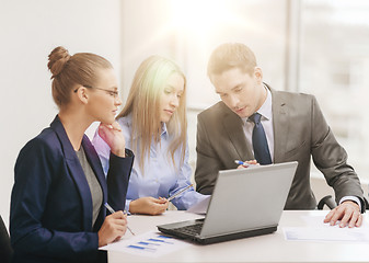 Image showing business team with laptop having discussion