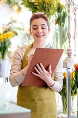 Image showing florist woman with clipboard at flower shop