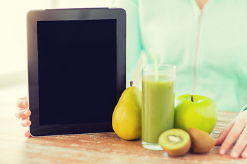 Image showing close up of woman hands tablet pc and fruit juice