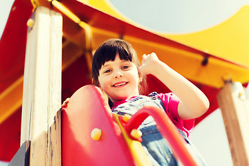 Image showing happy little girl climbing on children playground