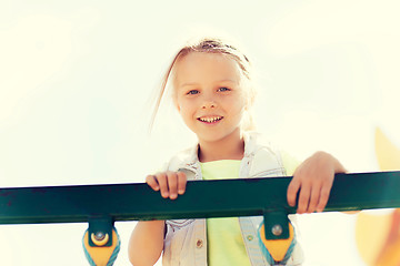 Image showing happy little girl climbing on children playground