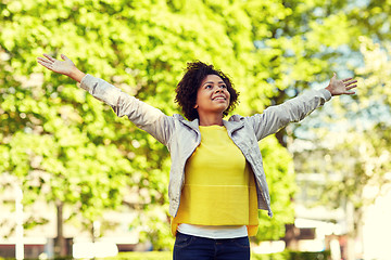 Image showing happy african american young woman in summer park