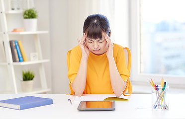 Image showing tired asian woman student with tablet pc at home