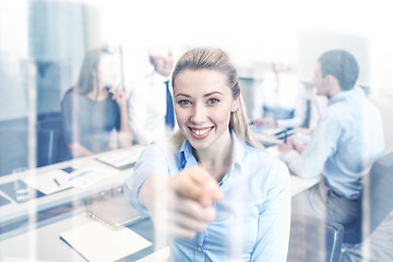 Image showing group of smiling businesspeople meeting in office