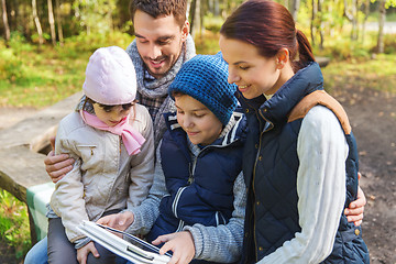 Image showing happy family with tablet pc at camp