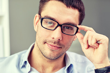 Image showing portrait of businessman in eyeglasses at office