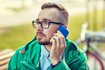 Image showing young hipster man calling on smartphone