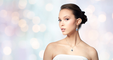 Image showing beautiful asian woman with earring and pendant