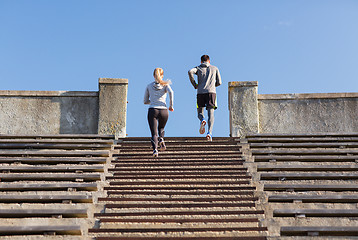 Image showing couple running upstairs on stadium