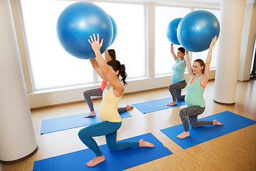 Image showing happy pregnant women exercising with ball in gym