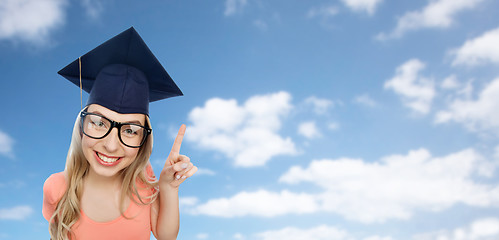 Image showing smiling young student woman in mortarboard