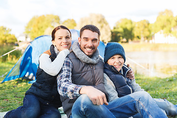 Image showing happy family with tent at camp site