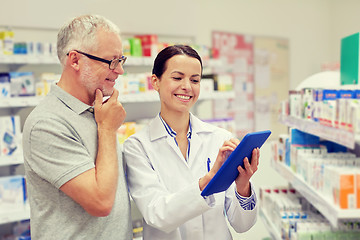 Image showing pharmacist with tablet pc and senior man