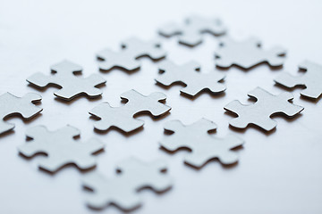 Image showing close up of puzzle pieces on table