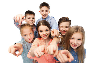 Image showing happy children pointing finger to you