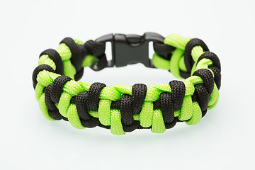 Image showing green braided bracelet on white background