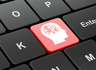 Image showing Advertising concept: Head With Finance Symbol on computer keyboard background