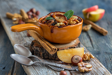 Image showing Baked oatmeal with apple, cinnamon and nuts.