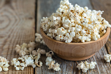 Image showing Popcorn in wooden bowl close up.