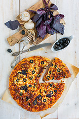 Image showing Large pizza with salami, olives and cheese.