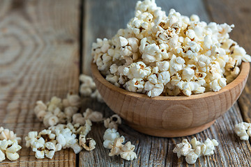 Image showing Popcorn in wooden bowl closeup.