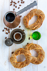 Image showing Turkish coffee and bagels with sesame seeds.